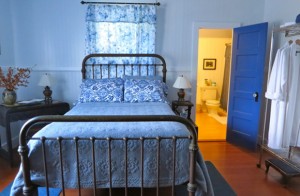 Waipio Wayside, Chinese Room, blue quilt bed with bathroom in background